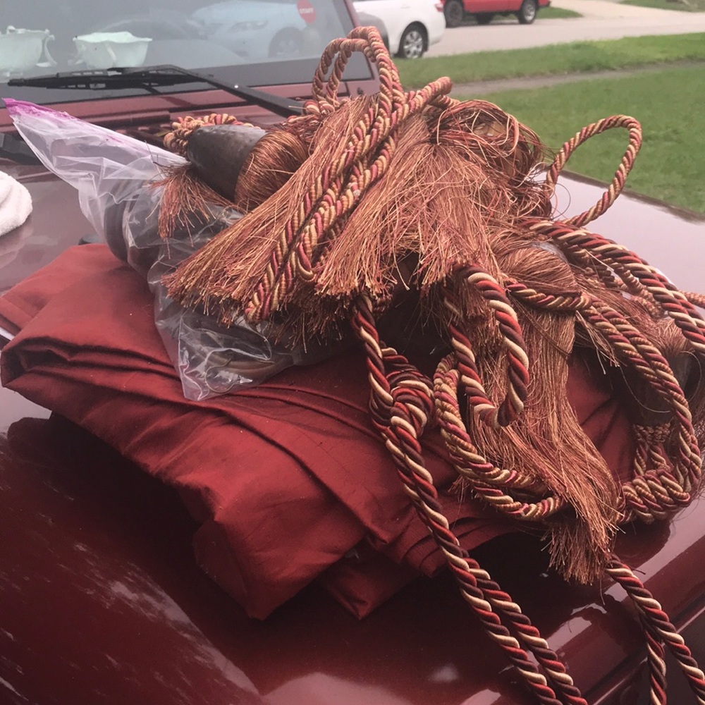 Very large maroon window treatments paid a lot